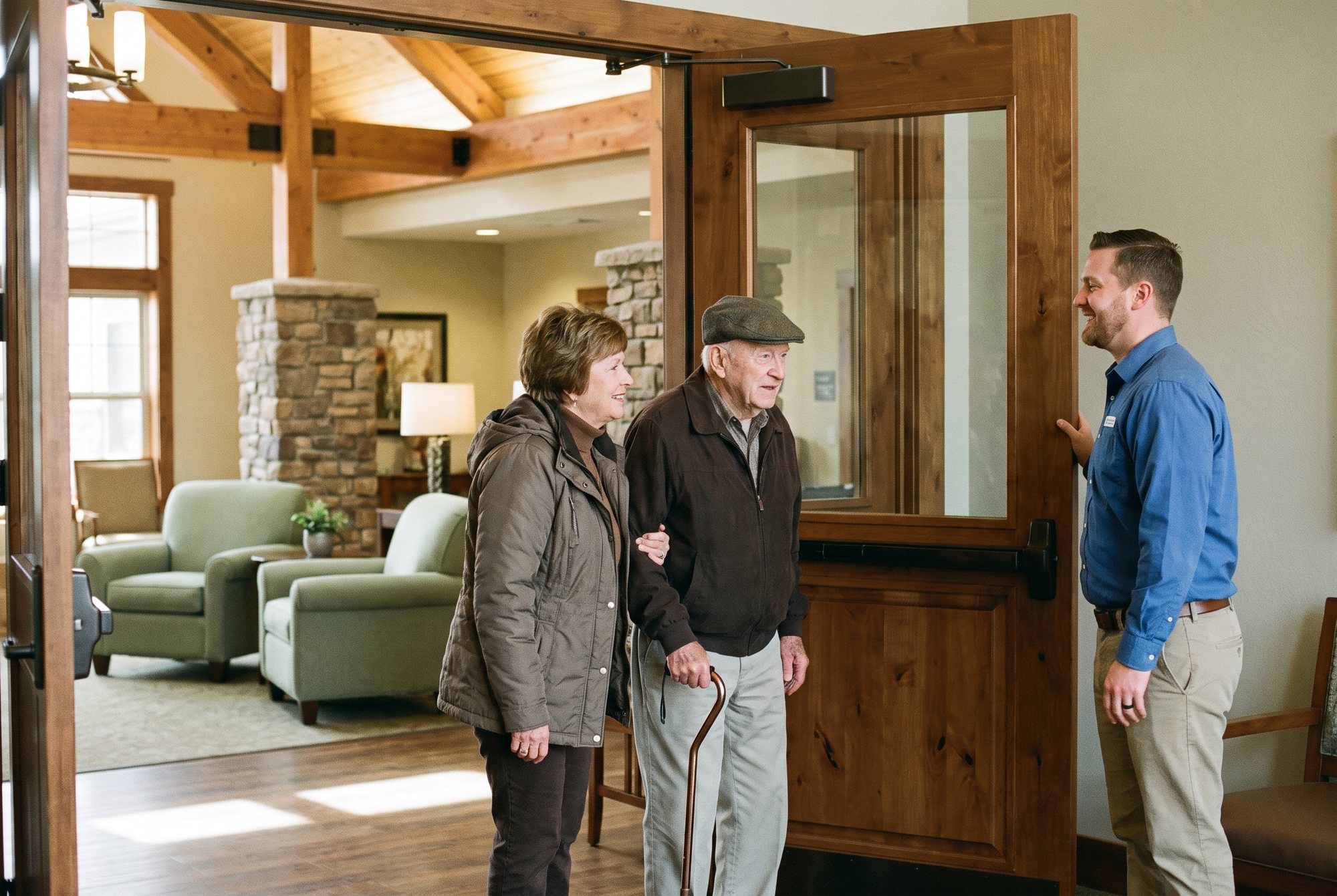 Staff member welcoming a family for a tour
